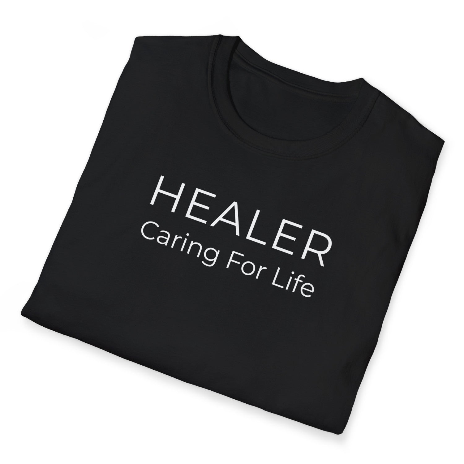 Folded Black Christian t-shirt with 'HEALER Caring For Life' text on a white background